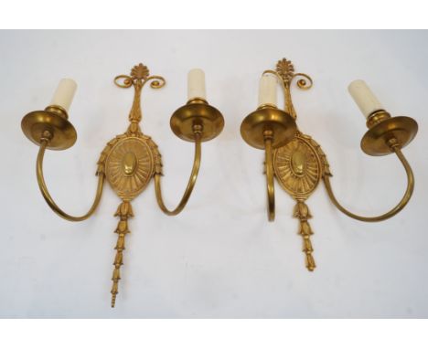 A pair of gilt-bronze twin-light wall appliques, second half 20th century, each backplate with central paterae issuing bell-f