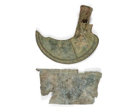 A bronze socketed sickle, Late Bronze Age, circa 1200-800 B.C., with hollow shaft, 18cm high, and a Urartian bronze belt frag
