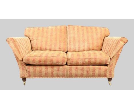 A modern two seat sofa, possibly by Duresta, with red and beige striped fabric upholstery, raised on mahogany bun feet and ca