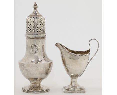 A George III silver milk jug, London, 1798, maker mark rubbed, of helmet form with punched rim and scroll handle, raised on a