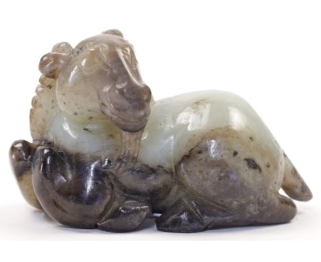 A Chinese jade model of a recumbent ram, 19th / 20th century, with turned head, horns and beard, 7.6cm longCondition Report: 