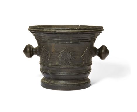 An Italian bronze mortar, late 17th century, the body cast with a band of acanthus leaves, with knopped ball handles, 17.5cm 