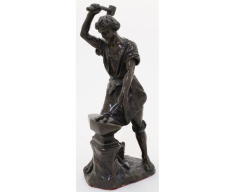After Edouard Drouot, French, 1859-1945, a bronze of a blacksmith working at his anvil, bearing signature to base, 27cm high