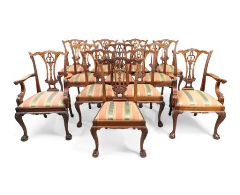 A set of twelve mahogany dining chairs, in Chippendale style, 20th century, to include two carvers, the elaborate carved spla