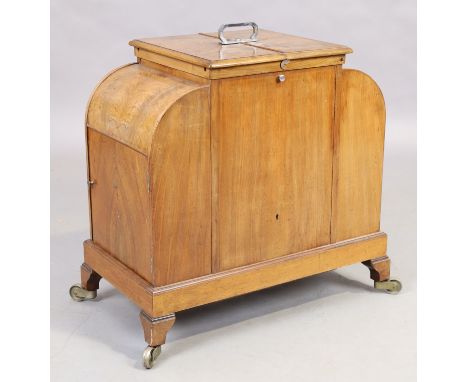 An Art Deco walnut 'Elevette' rising drinks cabinet, first quarter 20th century, the central rising tantalus to the centre re