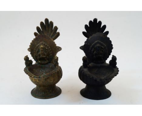 A bronze offering vessel with figure of Ganesha, Nepal, 17th-18th century, on a played foot, the globular body ribbed rising 
