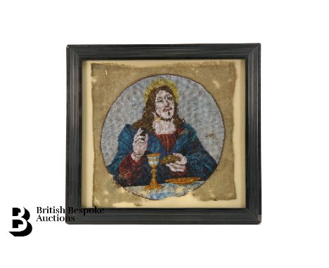 A micro bead tapestry of Jesus at the Last Supper, 19th century, approx 22.5 x 22.5 cms, framed and glazed.