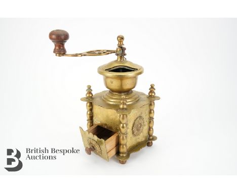 Early 20th century brass coffee grinder, likely German or Dutch, with a single drawer, in the form of temple shaped with a wo