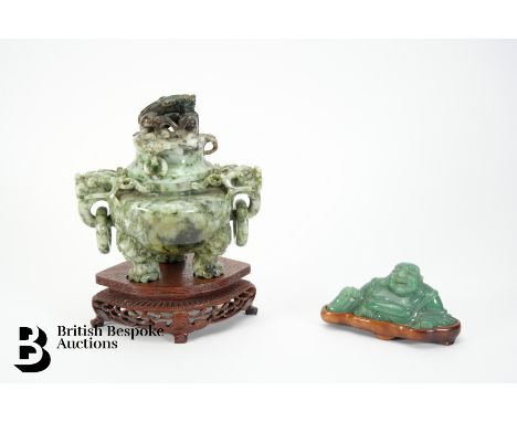 A Chinese green stone censer and cover, taotie mask handles and cover, approx 25 cms, on a footed teak stand. This lot includ