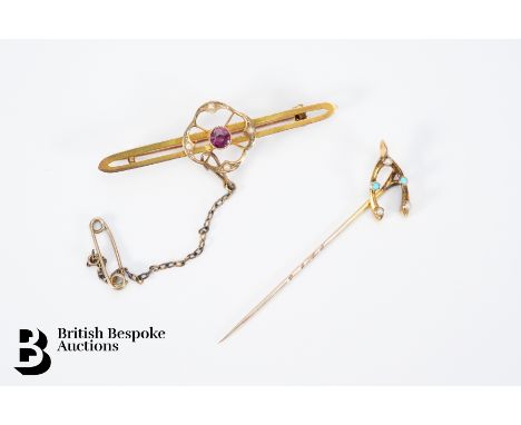 A 9ct gold bar brooch set with an amethyst enclosed by a seed pearl frame, approx 5 cms in length together with another 9ct g