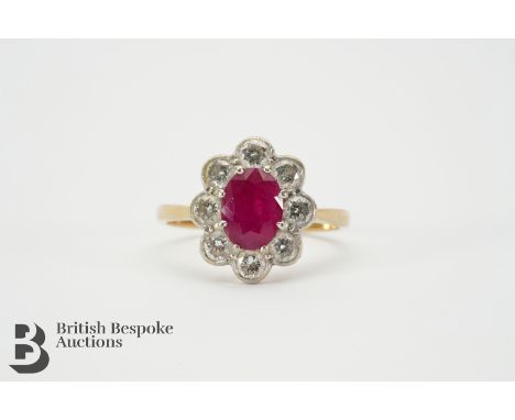 Vintage 18ct yellow gold natural ruby and diamond ring. The ring set with an oval ruby of 8 x 6mm, surrounded by 1.5cts of di