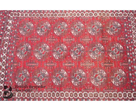 Turkish wool carpet, floral border 190 x 120 cms, a floral border enclosing a field of medallion, selvedges and tassels compl