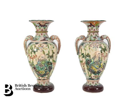 Pair of early 20th century Japanese Moriage enamel vases, decorated with a figure seated amongst bamboo and tree peony, appro