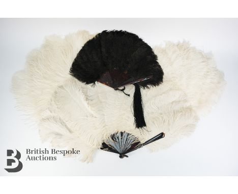 A black Ostrich feather fan on tortoiseshell monture with long tassel attached, guard stick approx 21 cms, open approx 47 cms