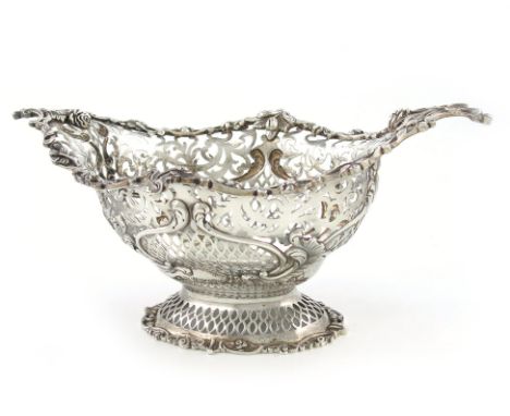 A late-Victorian silver basket, by Gibson and Langman, London 1899, oval form, pierced and embossed with trellis and foliate 