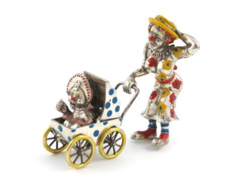 A modern Italian silver and enamel model of a clown and pram, also crudely stamped Tiffany and Co, modelled as a lady clown p