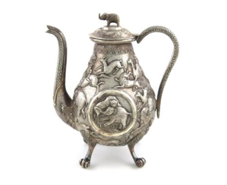 A late 19th century Indian silver coffee pot, possibly Lucknow, baluster form, chased with various hunting scenes including a