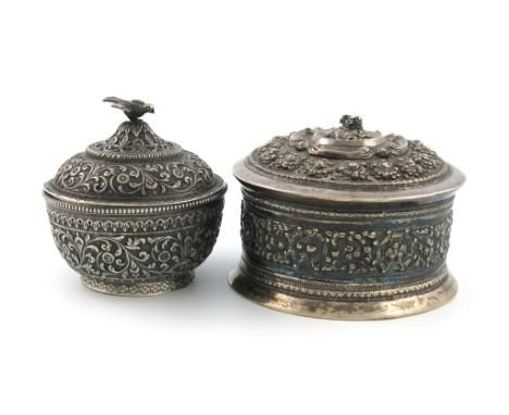 A Burmese silver Betel box, with an animal signature to the base, Shan States, circular form, embossed decoration, pull-off c