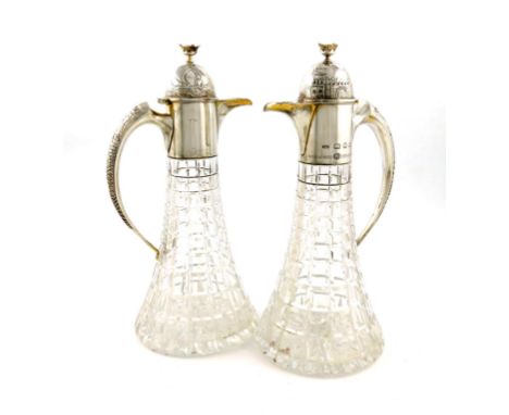 By Anthony Elson, a pair of commemorative silver-mounted glass claret jugs, London 1973, no.19/100, celebrating Bristol's Roy