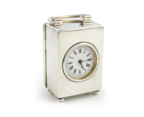 A late-Victorian silver carriage clock, by Charles Henry Dumenil, London 1895, plain rectangular form, hinged carrying handle