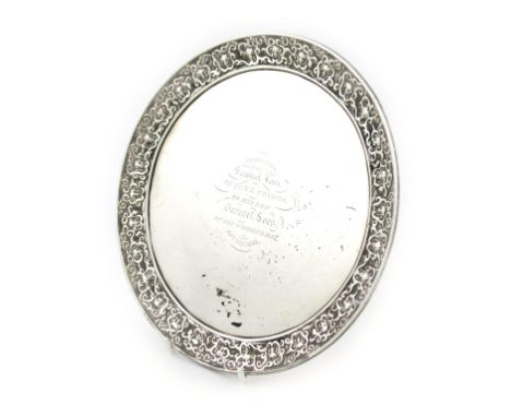 A Victorian silver tray, by John Samuel Hunt, London 1858, circular form, mask and scroll border, the centre inscribed 'Prese