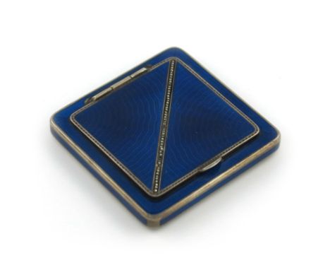 An Austrian silver and enamel compact, square form, dark blue enamel decoration, the hinged cover with a marquisette border, 