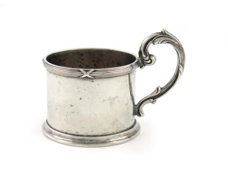 By Fabergé, a Russian silver tea glass holder, 1896-1908, circular form, leaf-capped scroll handle, ribbon and reed border, o