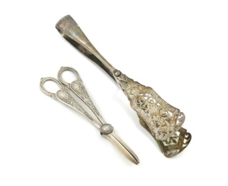 A pair of Victorian silver serving tongs, by E. Hutton, London 1885, pierced and engraved blades, length 25.5cm, plus a pair 