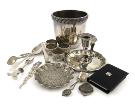 A mixed lot, comprising silver items: a tablespoon, a pair of sugar tongs, a baby feeding spoon, an olive fork, an Indian dis