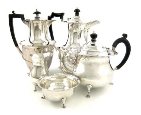 A three-piece silver tea set and similar hot water pot, by R. Pringle, London 1915, the hot water pot by H. Atkins, Sheffield