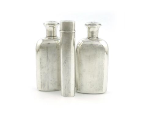 A pair of Indian silver toilet bottles and a tooth brush case, by Cooke and Kelvey, Calcutta, rounded rectangular form, engin