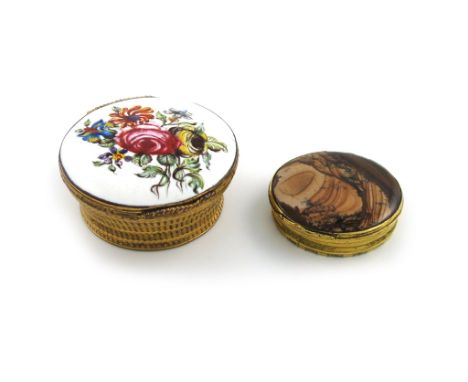 An 18th century gilt metal and agate snuff box, unmarked, circular form, the mount with chased decoration, the hinged cover s
