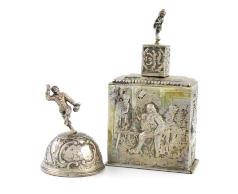 A Dutch silver tea caddy, 1905, rectangular form, embossed with tavern scenes, pull-off cover with a figural finial, slide-of