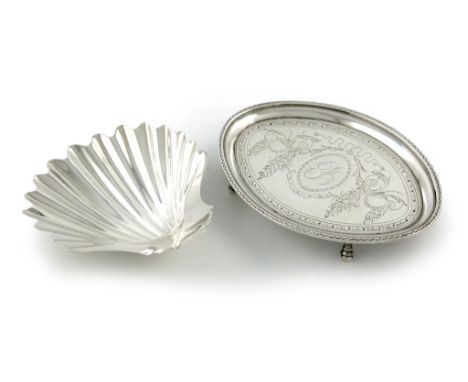 A George III silver teapot stand, by Thomas Chawner, London 1786, oval form, bright-cut decoration, initialled, on four feet,