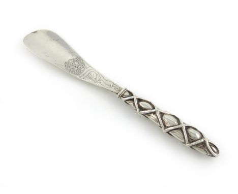 An Edwardian silver Arts and Crafts silver shoe horn, Birmingham 1902, maker's mark partially lost in repair, &CR, possibly f