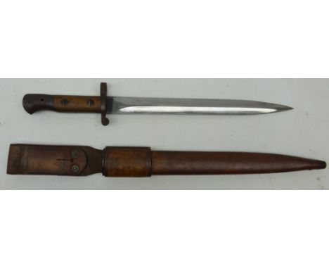 British WWll Bayonet, 30cm twin edge fullered bale stamped Wilkinson London, part wood grip, in leather sheath, mount stamped