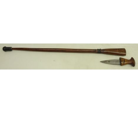 Carved African hardwood walking stick with dagger handle, carved decoration, rubber stopper added to the base, L81cm, blade l