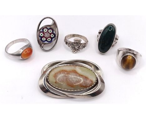 A silver and hardstone brooch, and assorted silver rings (6) Provenance: Sold on behalf of the Yeovil Hospital Charity