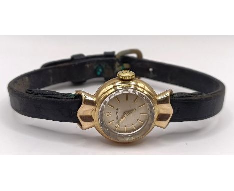 A ladies 9ct gold Omega wristwatch, with a leather strap, in a vintage jewellery boxLater strap, the box is well worn