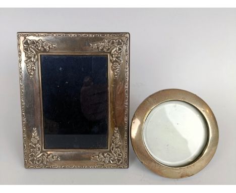 A modern silver photograph frame, Sheffield 1966, 18 x 14 cm, and a round photograph frame, 12 cm diameter (2)