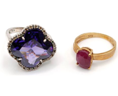 A 10ct gold and red stone ring, ring size G, and a silver and purple stone ring, ring size K (2)