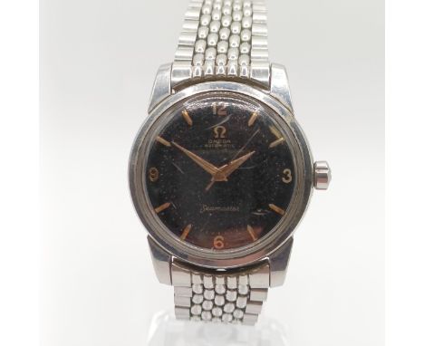 A gentleman's stainless steel Omega Seamaster wristwatchWell worn