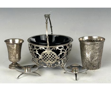 An Edward VII pierced silver basket, London 1902, 3.7 ozt, with a blue glass liner, an Indian beaker, an Eastern shot cup, an