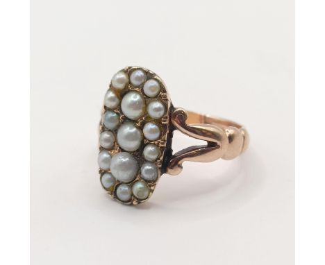 A yellow coloured metal and seed pearl panel ring, probably 19th century, ring size K