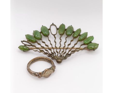 An antique silver ring, and a yellow metal and green stone fan brooch, lacking two stones (2)