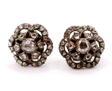 A pair of diamond stud earrings