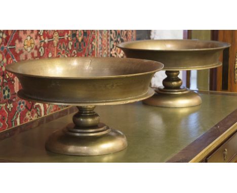 BRONZE CENTREPIECE BOWLS, a pair, each with a circular dished top, 50cm diam x 25cm H. (2)