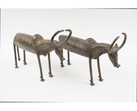 LOBI BRONZE BUFFALOES, a pair, Burkino Faso, each 32cm L x 23cm H max. (2)