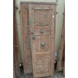 A good pair of Indian carved hardwood doors with bronze mounts.