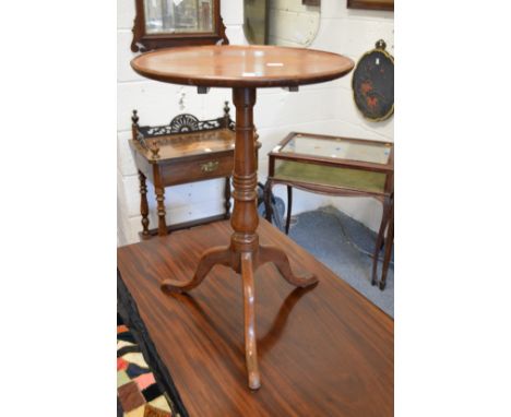 A mahogany tripod table.